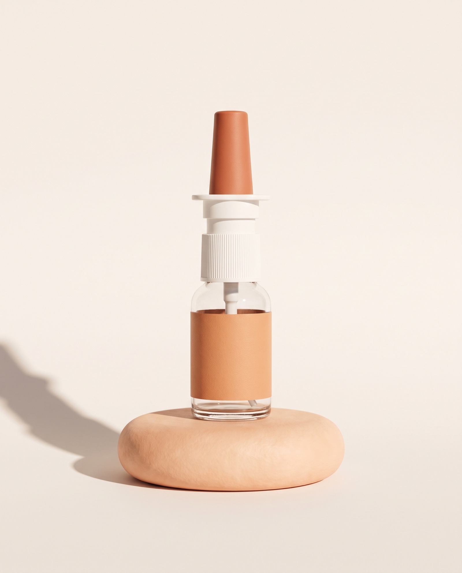 Tanners tanning spray on a peach stone plinth